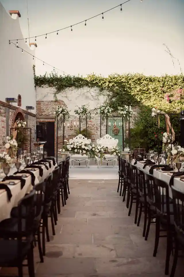 outdoor event. tables are beautifully set for a special dinner celebration.